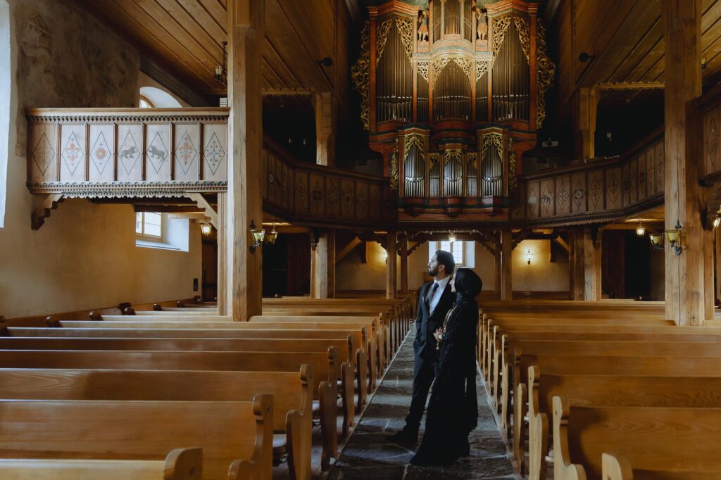 Couple stading in Saanen's church.