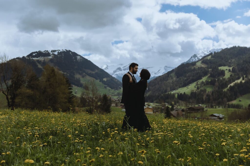 Couple in dandelion field near Gstaad.