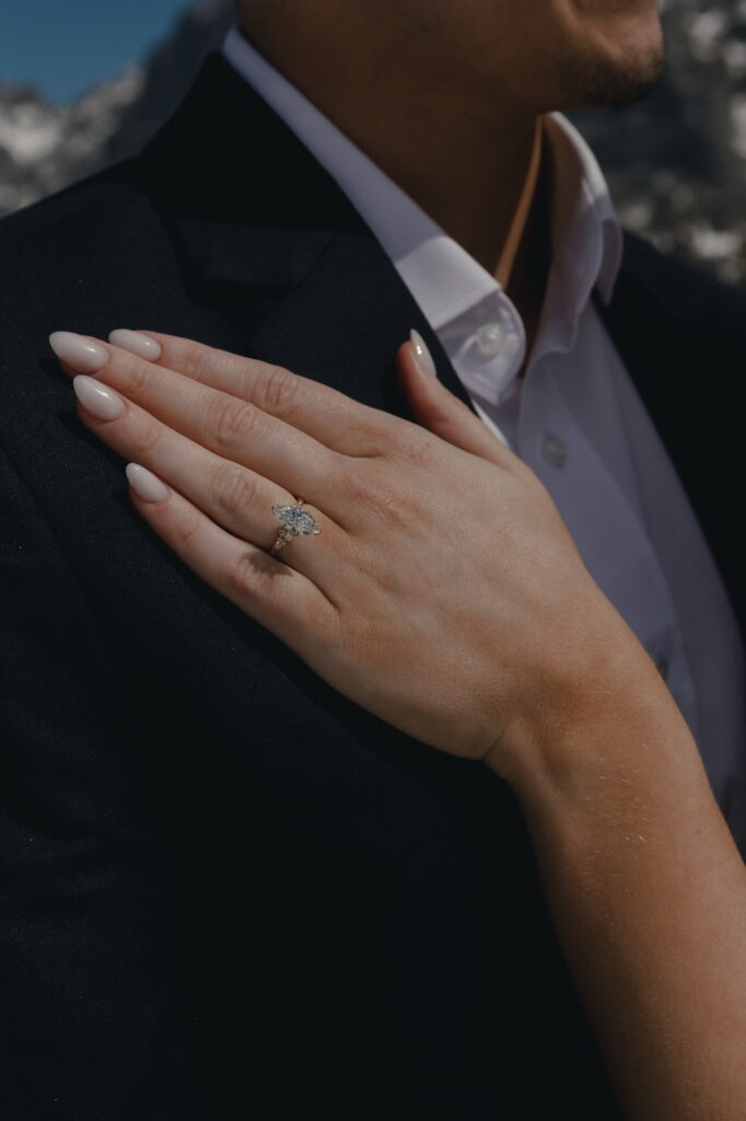 A close-up of an engagement ring.
